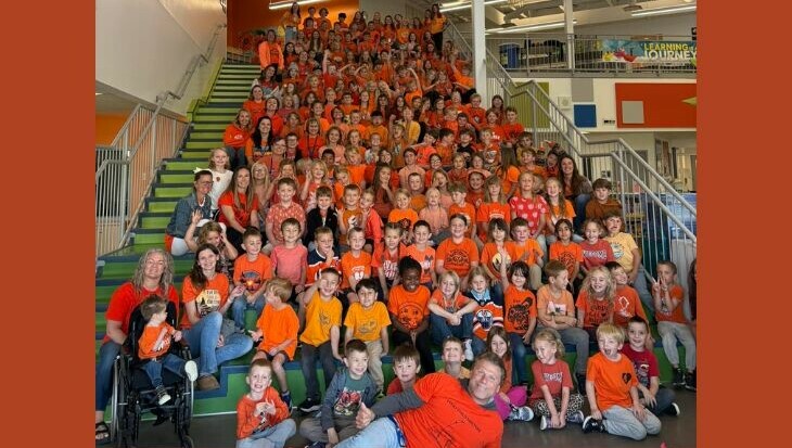 Dozens of Beacon Hill students wearing orange shirts